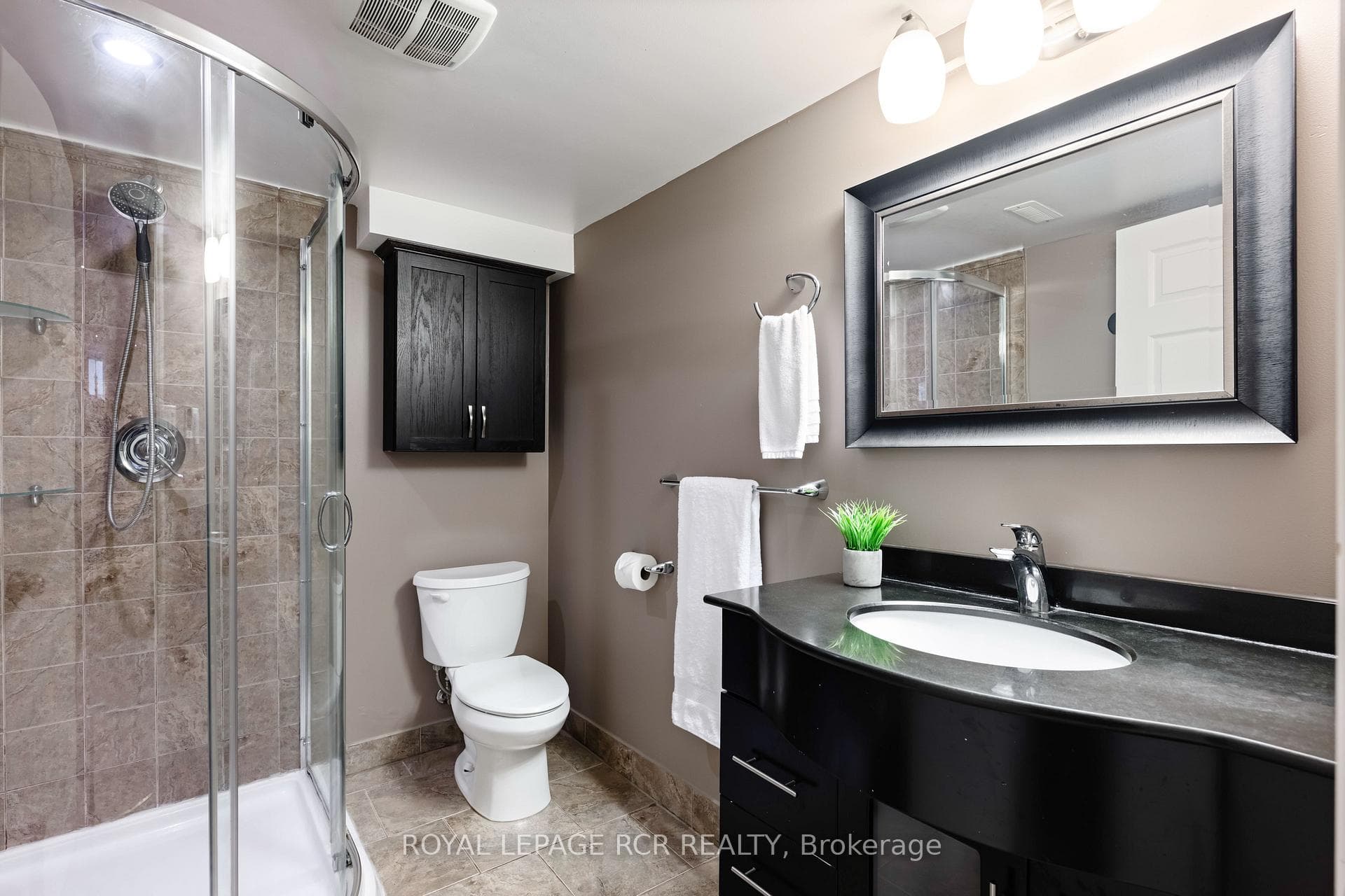 Renovated 3 piece bathroom with walk in shower.