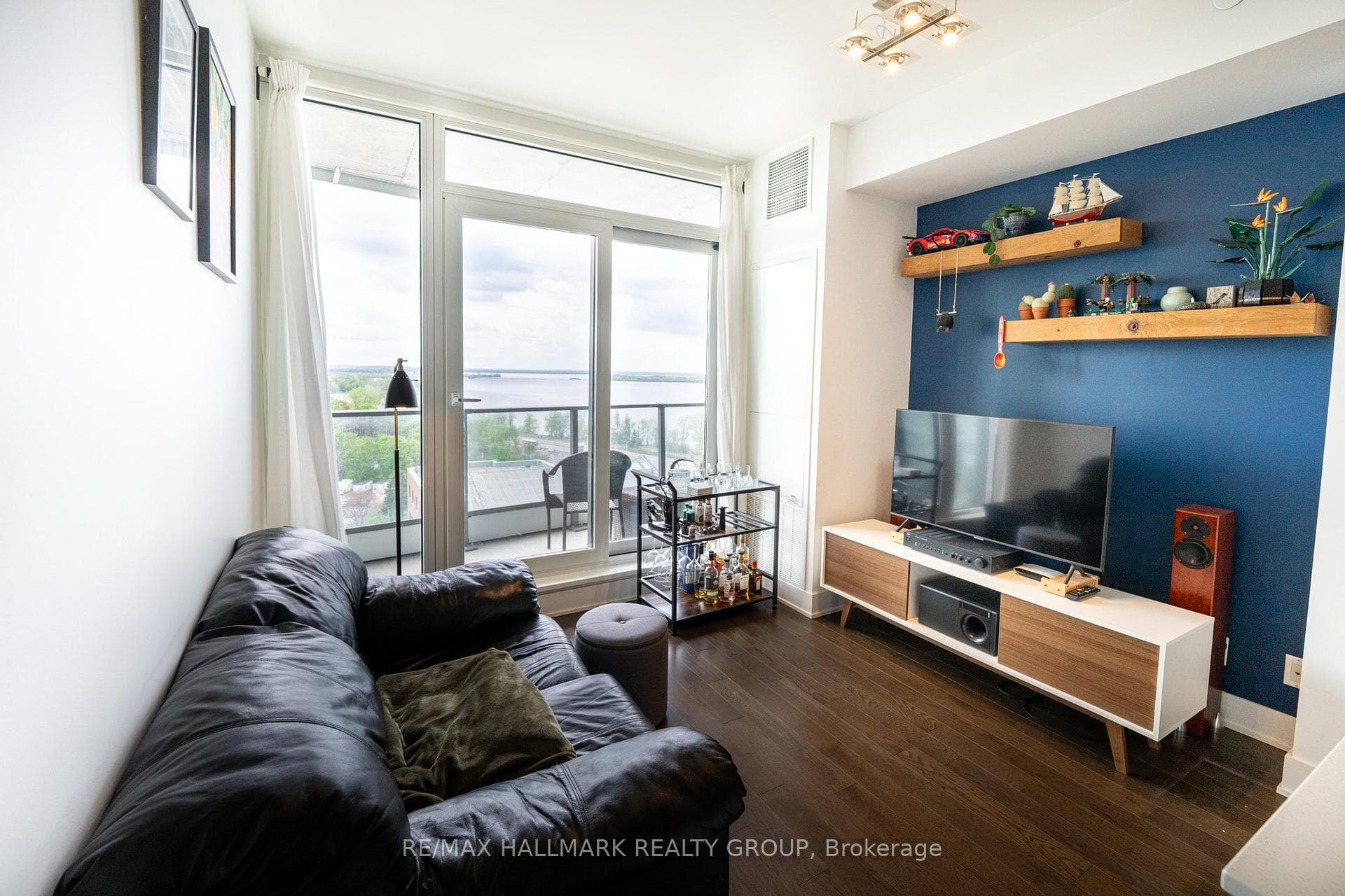 Living Room with Hardwood and Walk-Out Balcony