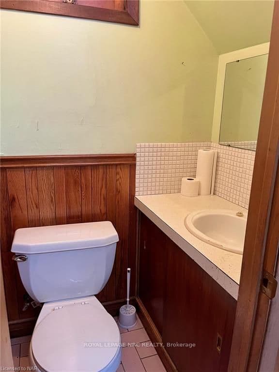 The 2 pc bath is located off the laundry area
