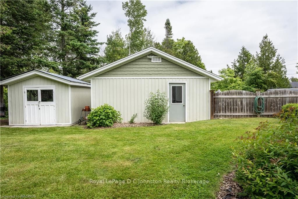 Metal roof outbuilding and large garage