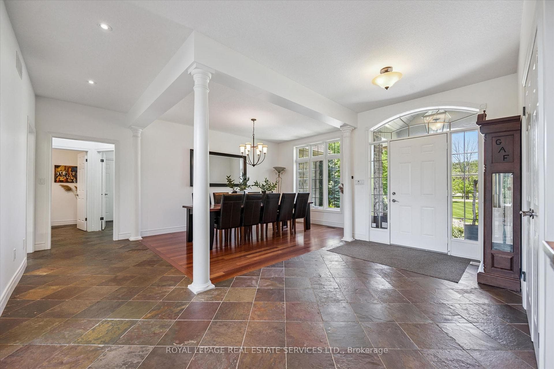 Spacious Dining Room Offers Hardwood Flooring