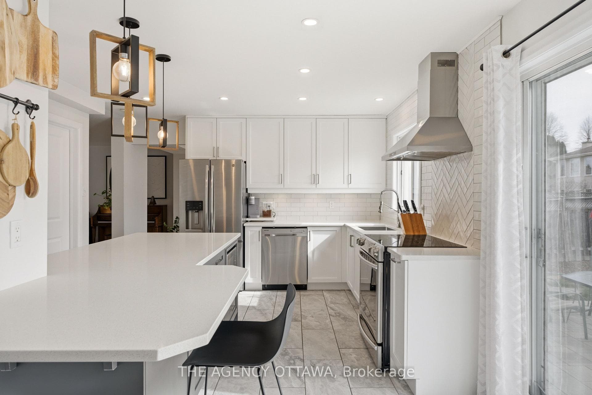 Open kitchen with patio door & pendant lights