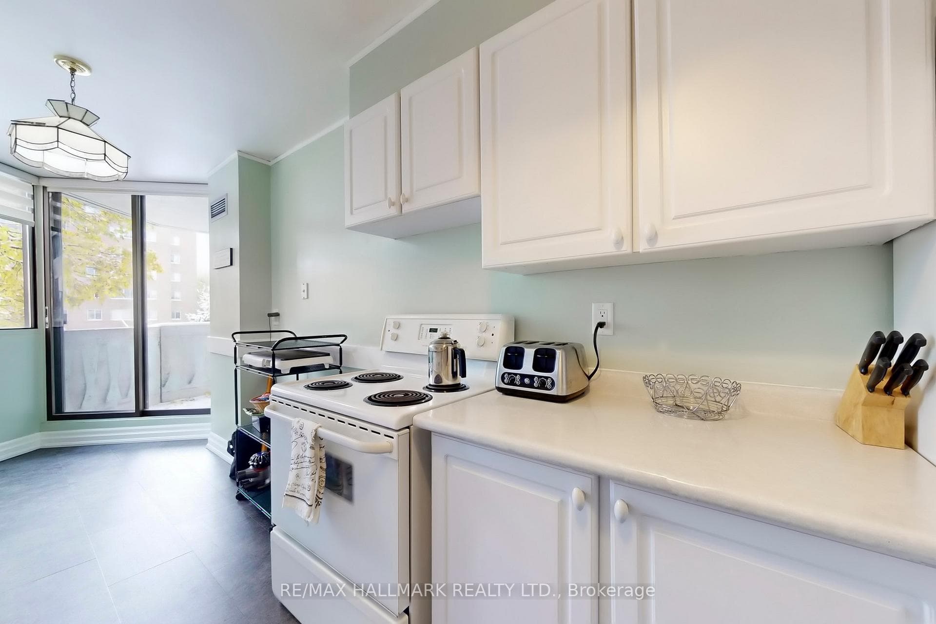 South facing kitchen with walk out to balcony