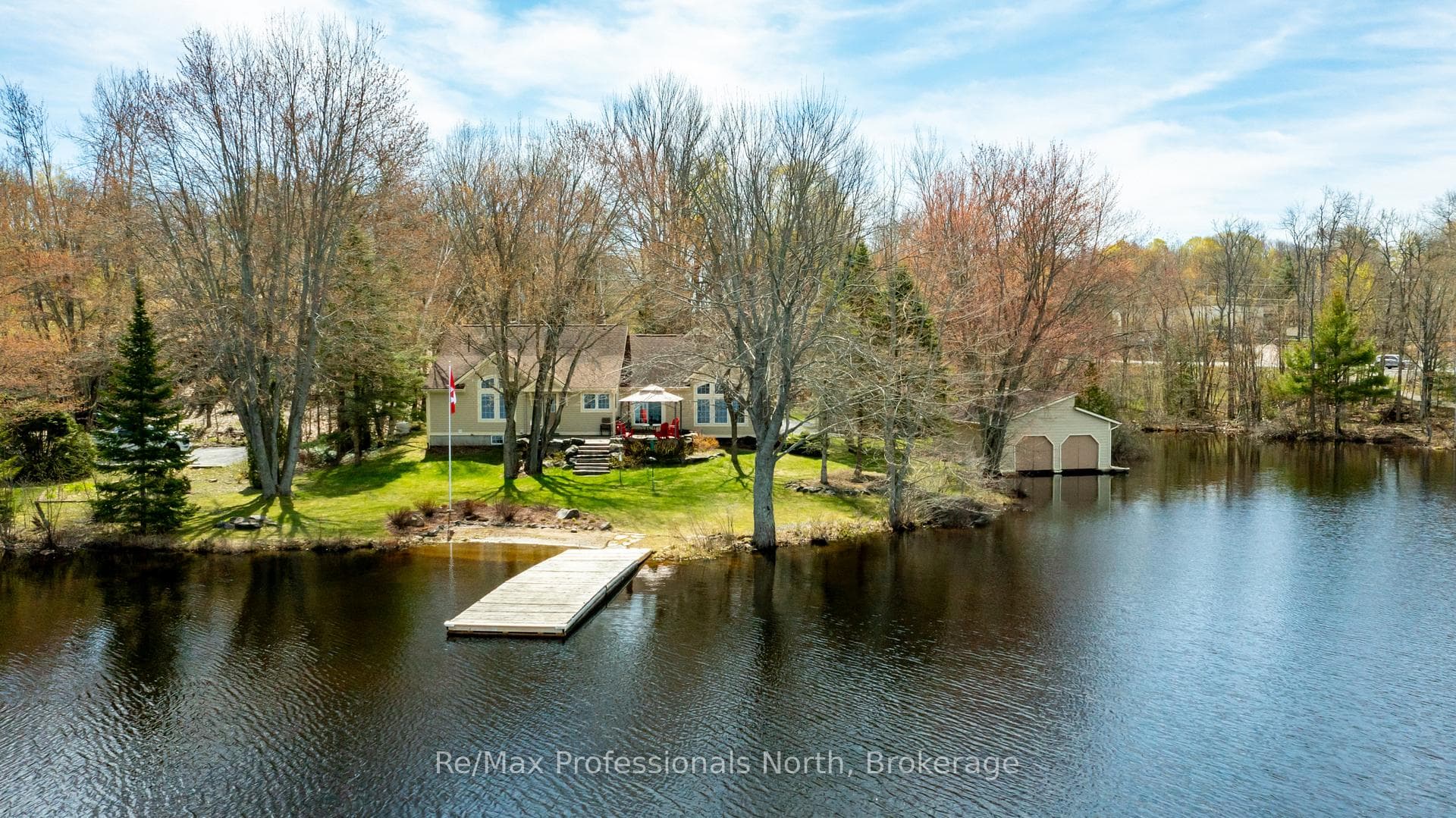 Cottage, dock, beach and double boathouse