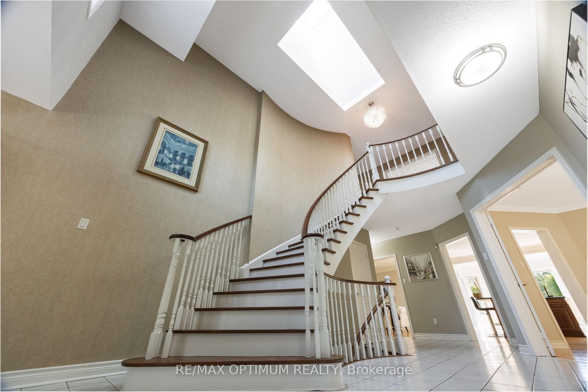 Grand circular staircase with skylight