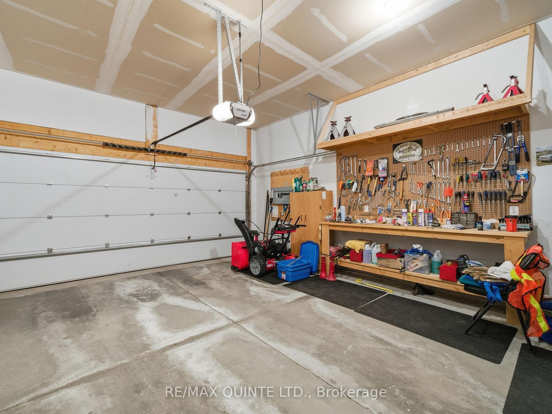 Two car garage, with large workshop area.