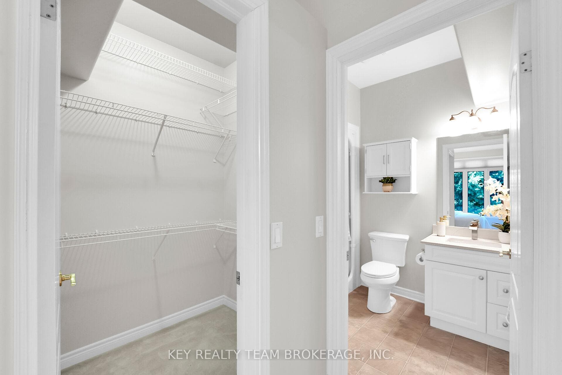 primary walk-in closet and bathroom