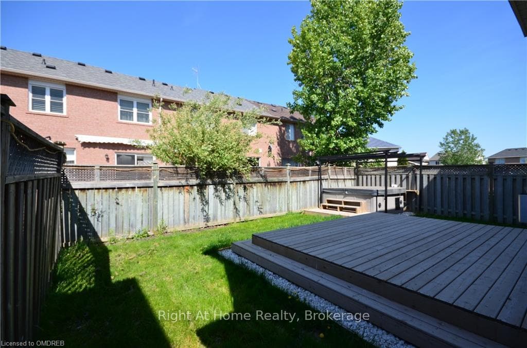 View of yard featuring a wooden deck