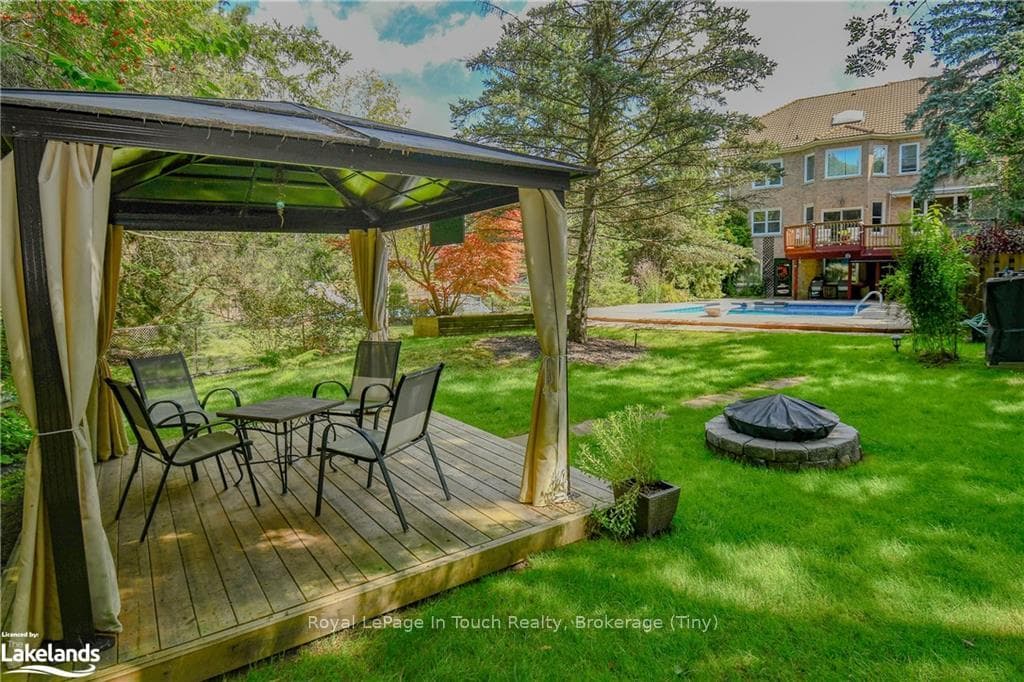 Wooden deck featuring a yard and a gazebo