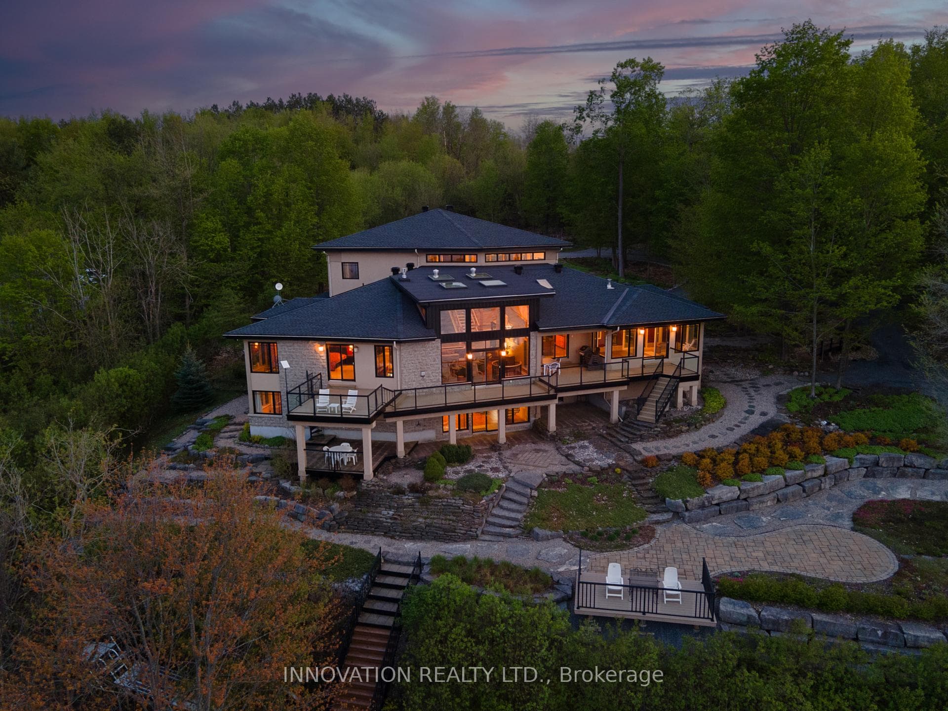 3 levels with walls of windows overlook the river
