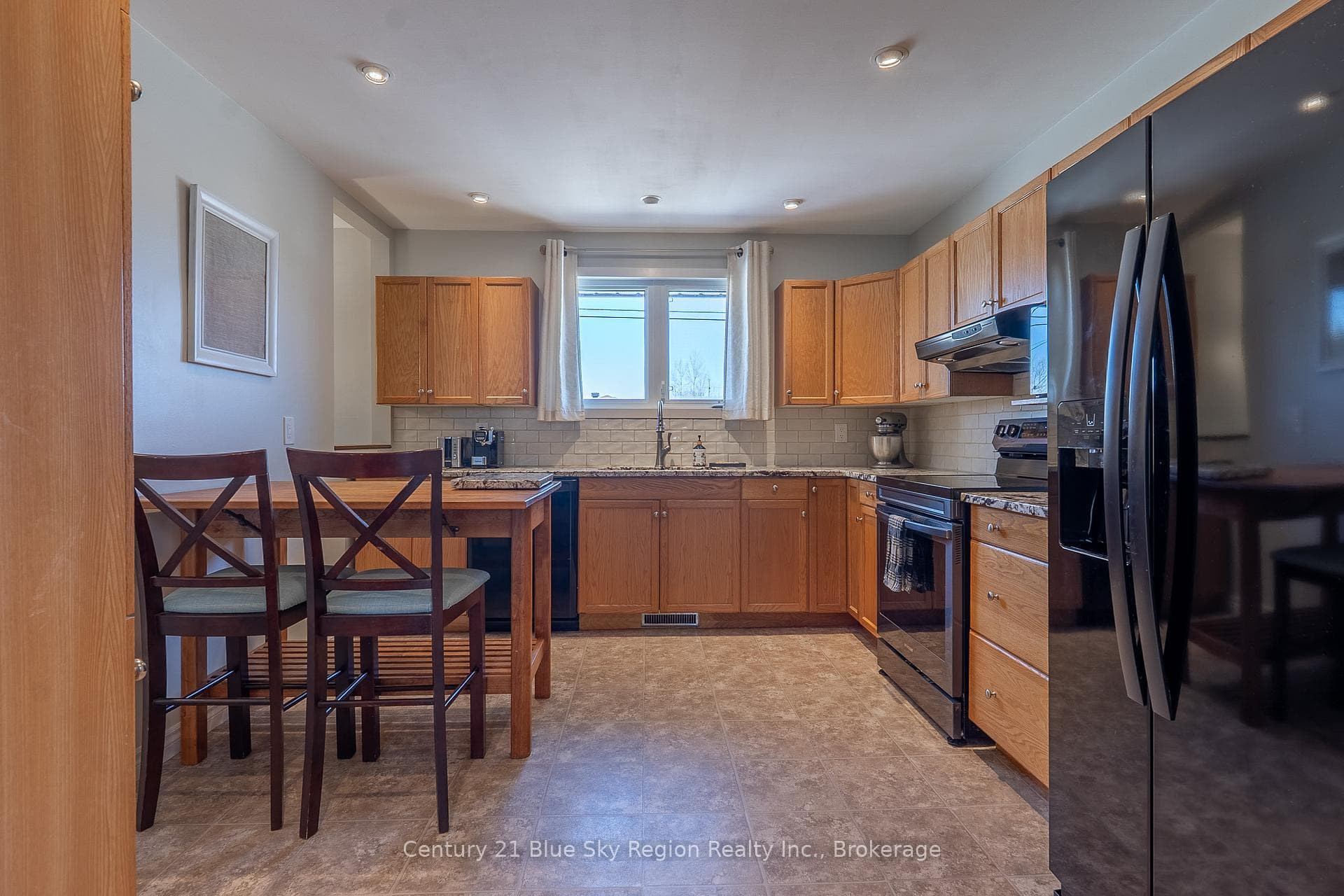 Oak Kitchen Featuring Granite Countertops