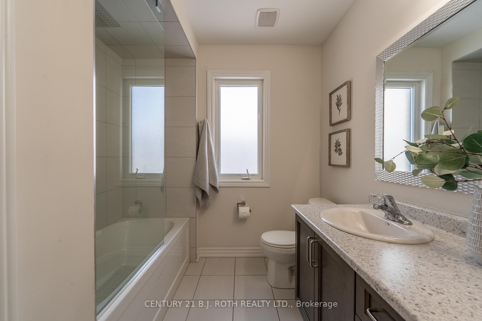 Second bathroom with custom glass in shower