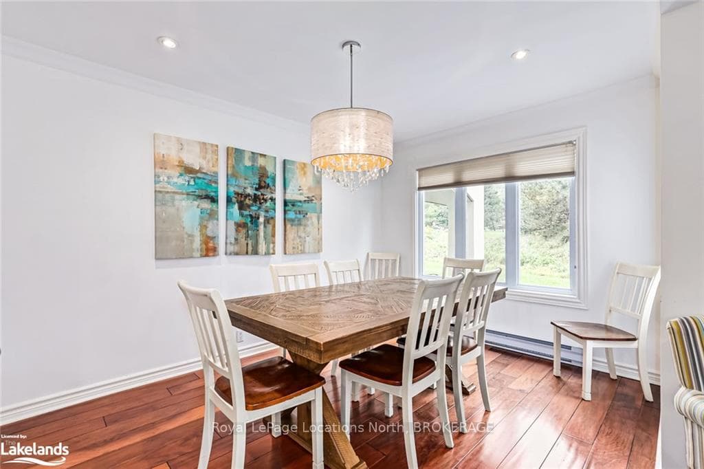 Dining room featuring crown molding, hardwood / wo