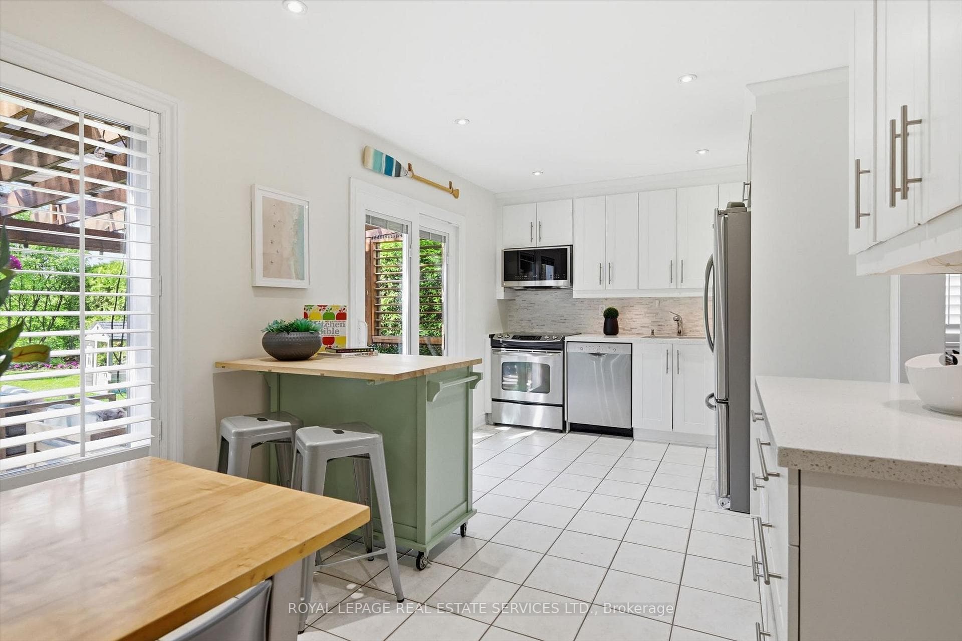 Dining Area with Gas Fireplace is Open to Kitchen