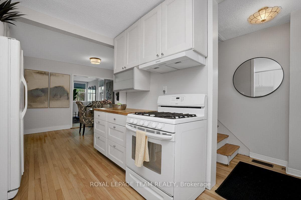 Galley kitchen with gas stove.