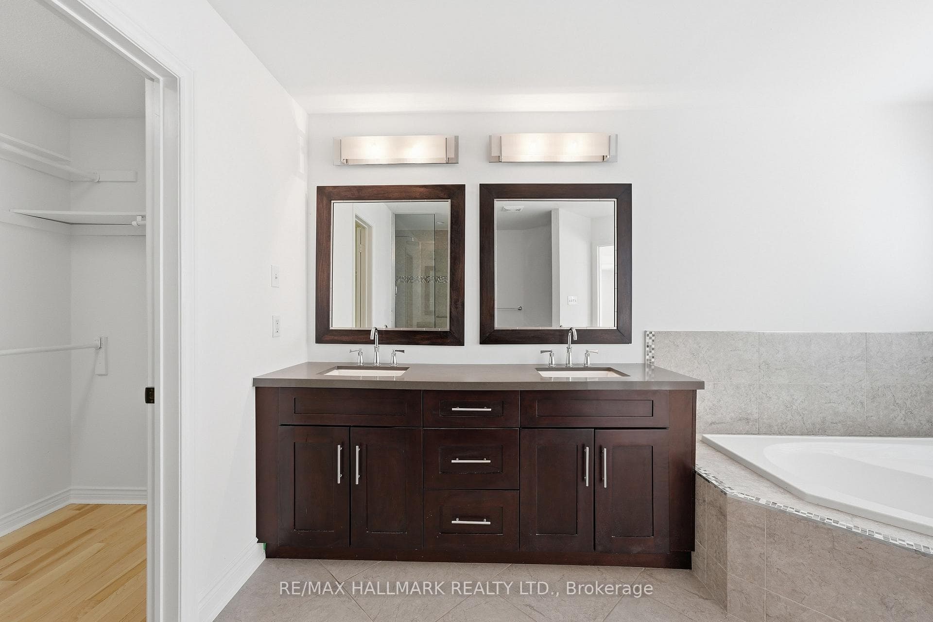 Double Vanity with Large Tub and Closet Access