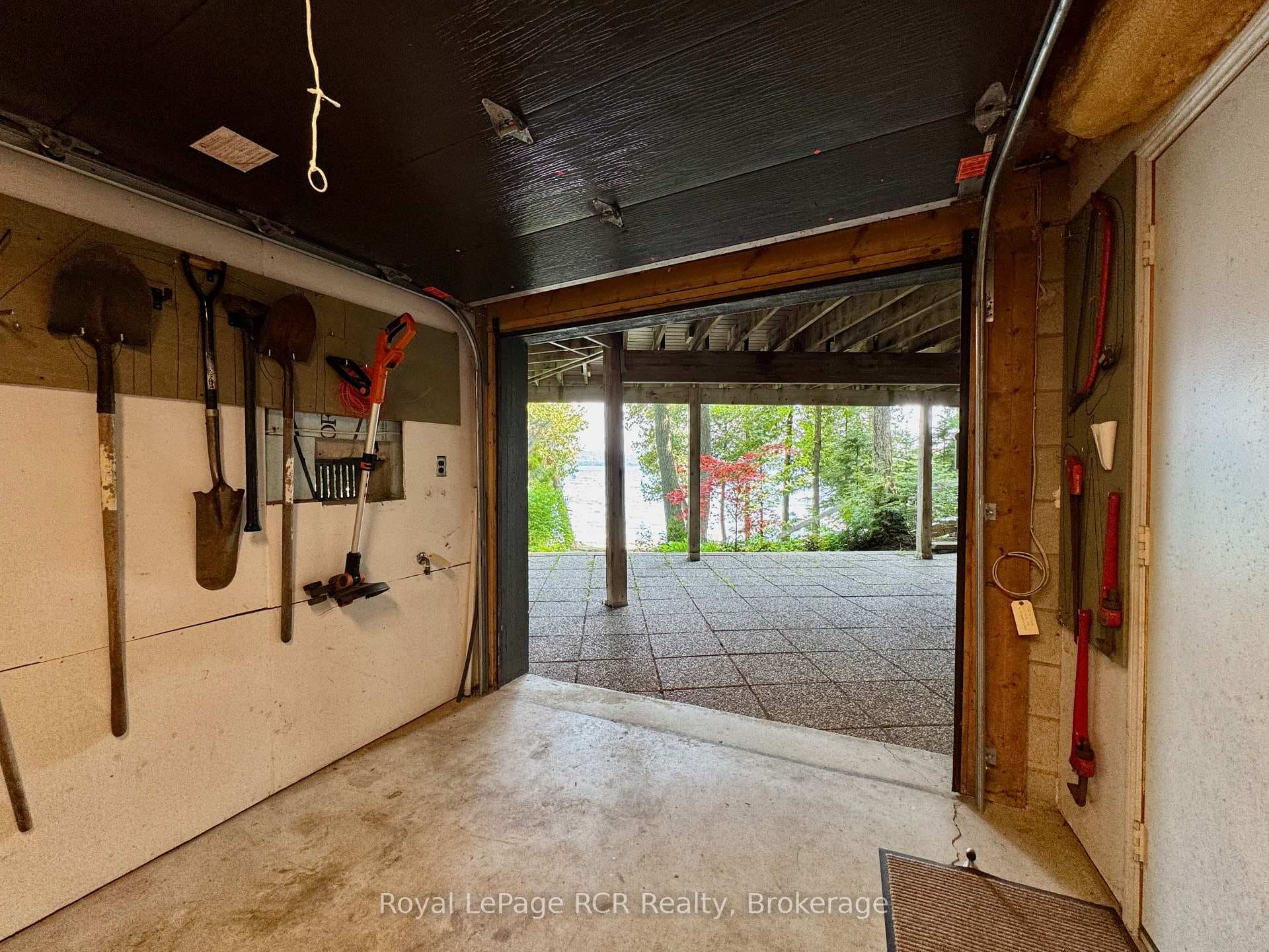 With insulated overhead door to waterside patio.