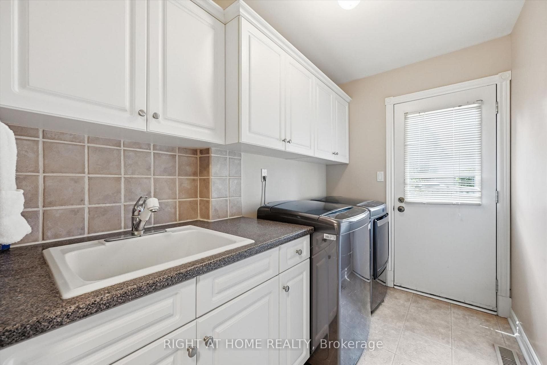 Main Floor Laundry w/ Direct Backyard Access
