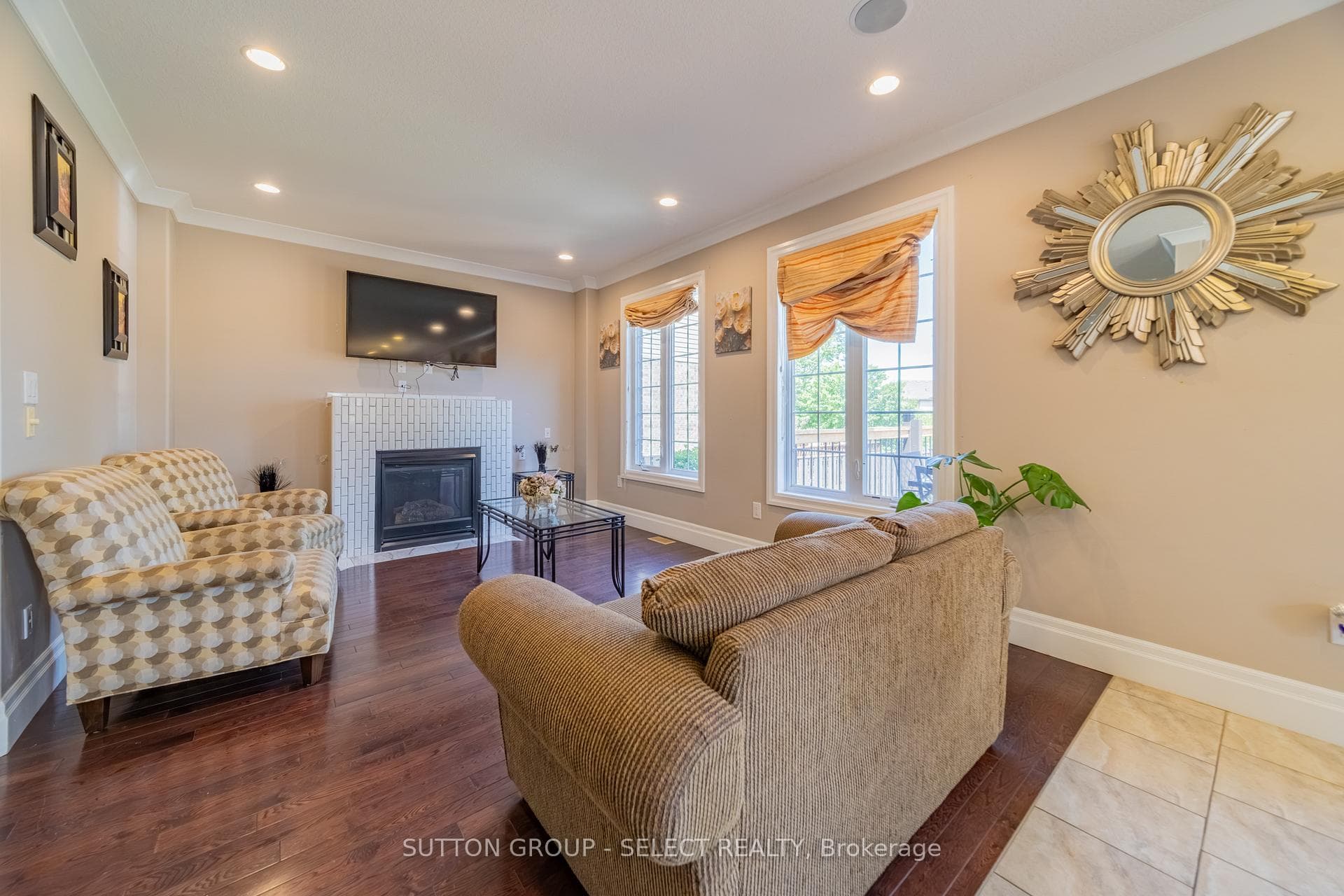 Bright Family Room with Fireplace & Hardwood Floor