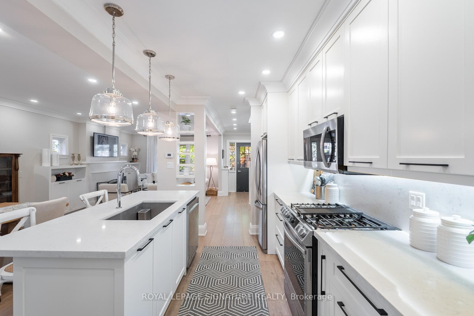 Kitchen w SS appliances and gas range