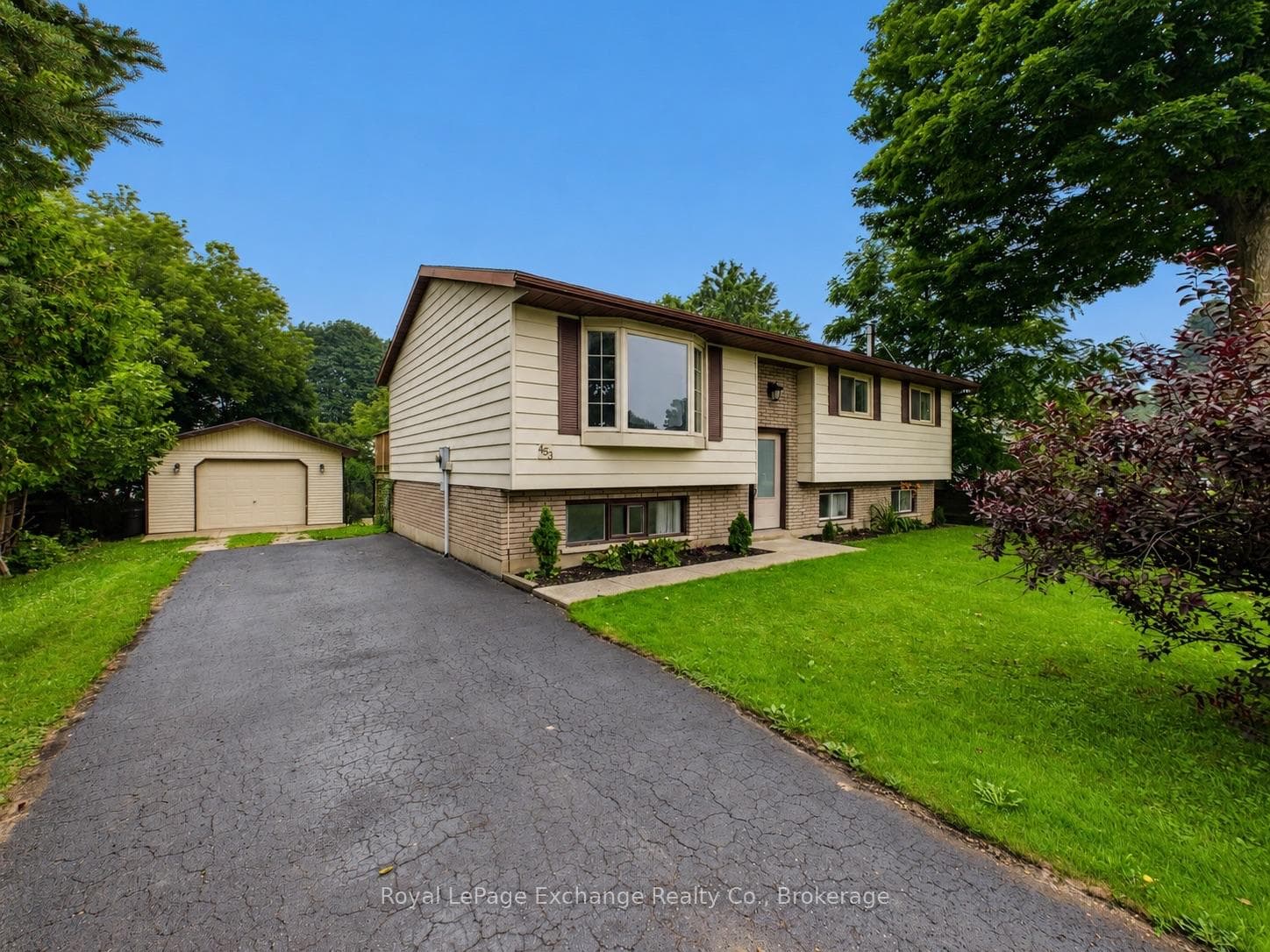 Detached garage, paved driveway
