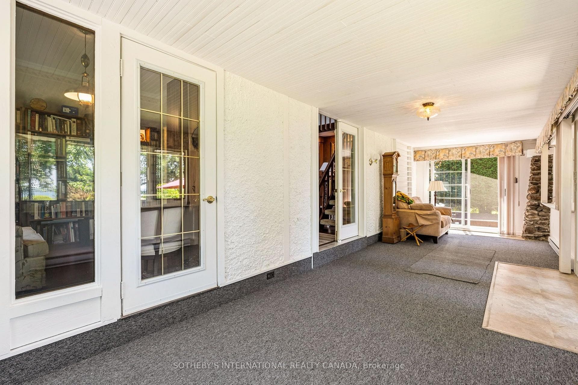 Enclosed front porch.
