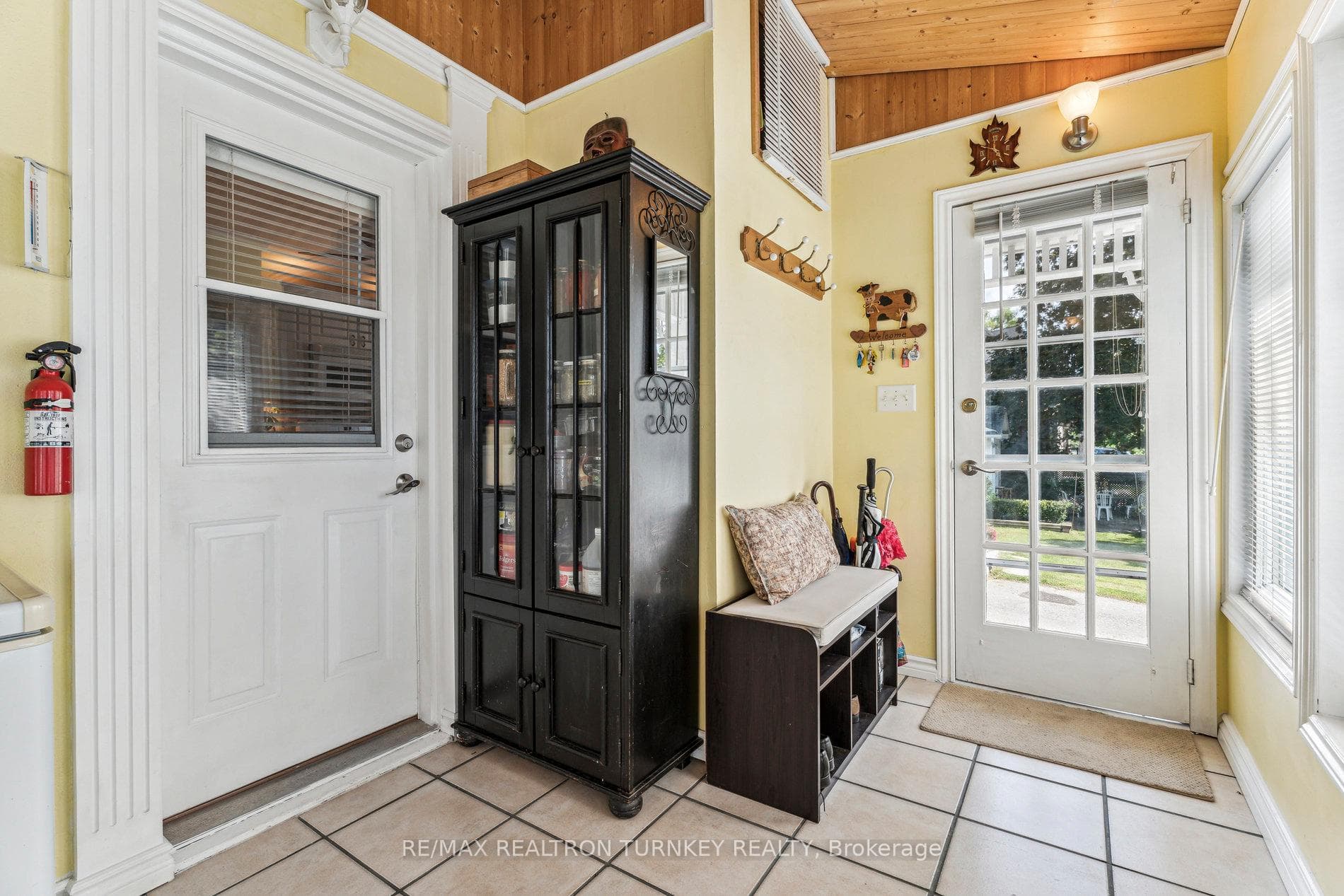 Mudroom with W/O to Porch on each side.