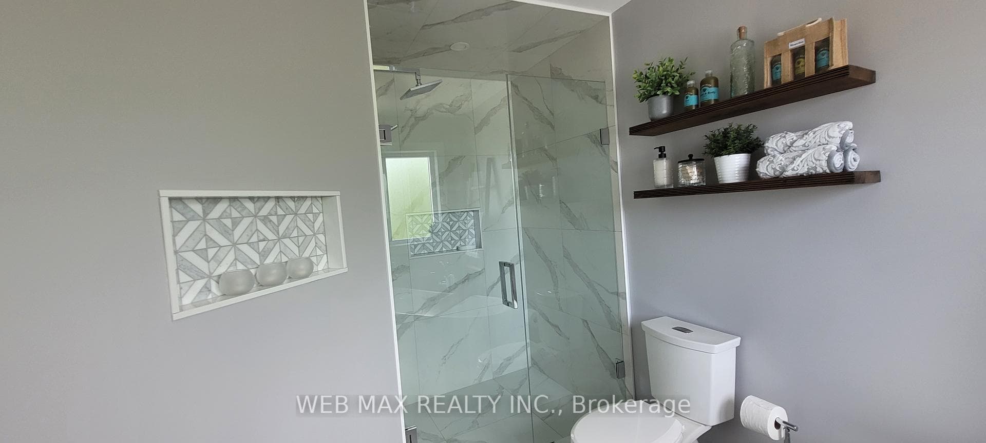 Glass Shower with niche in prime bathroom