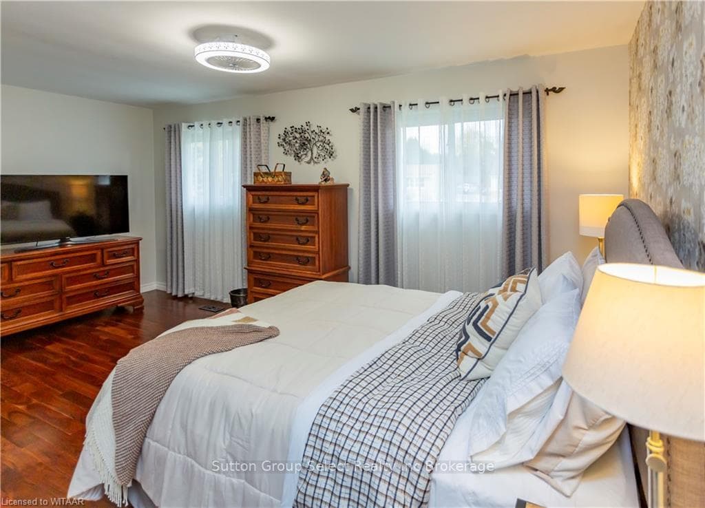 Bedroom featuring dark hardwood / wood-style floor
