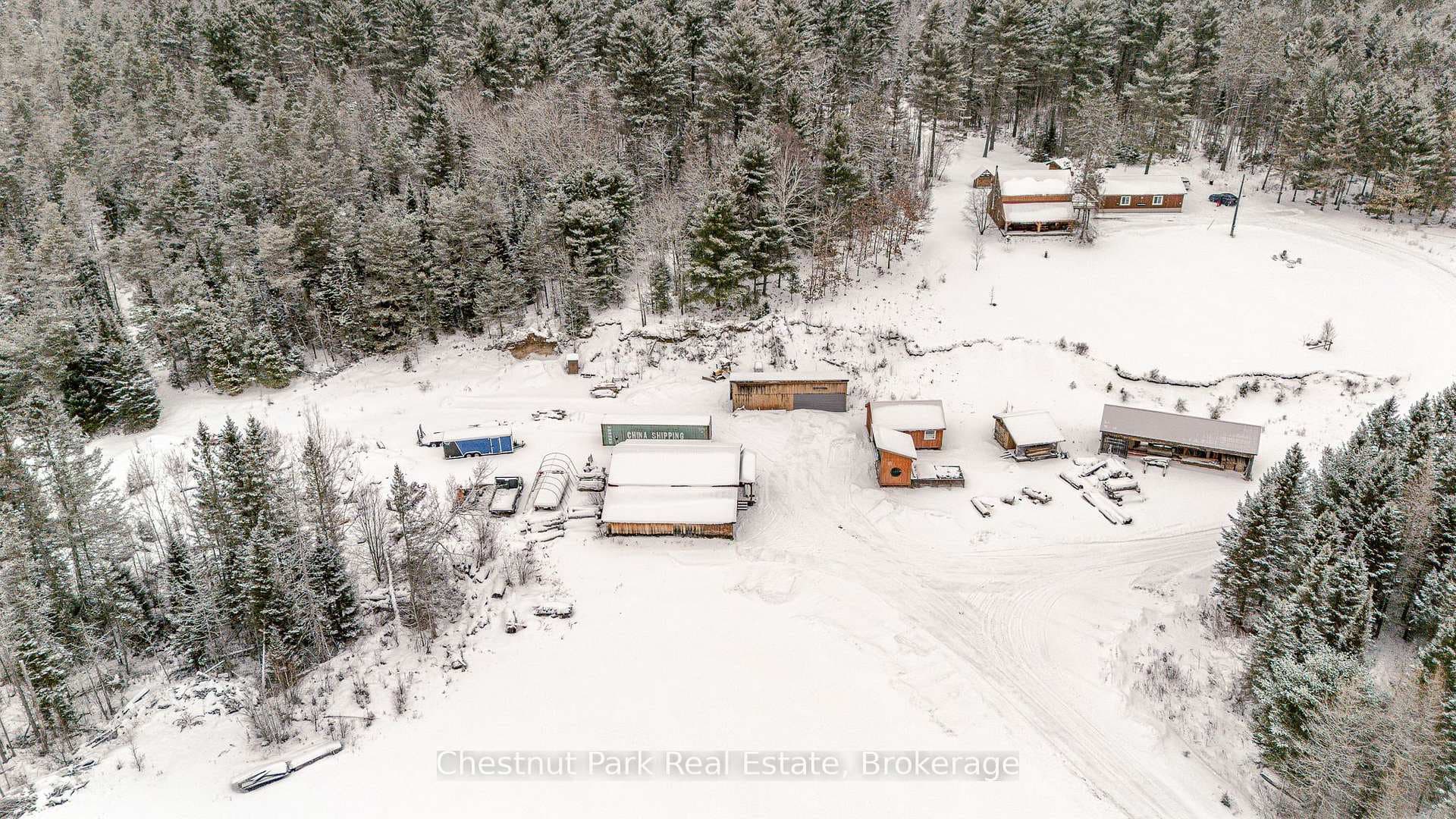 Overview of outbuildings and home/garage