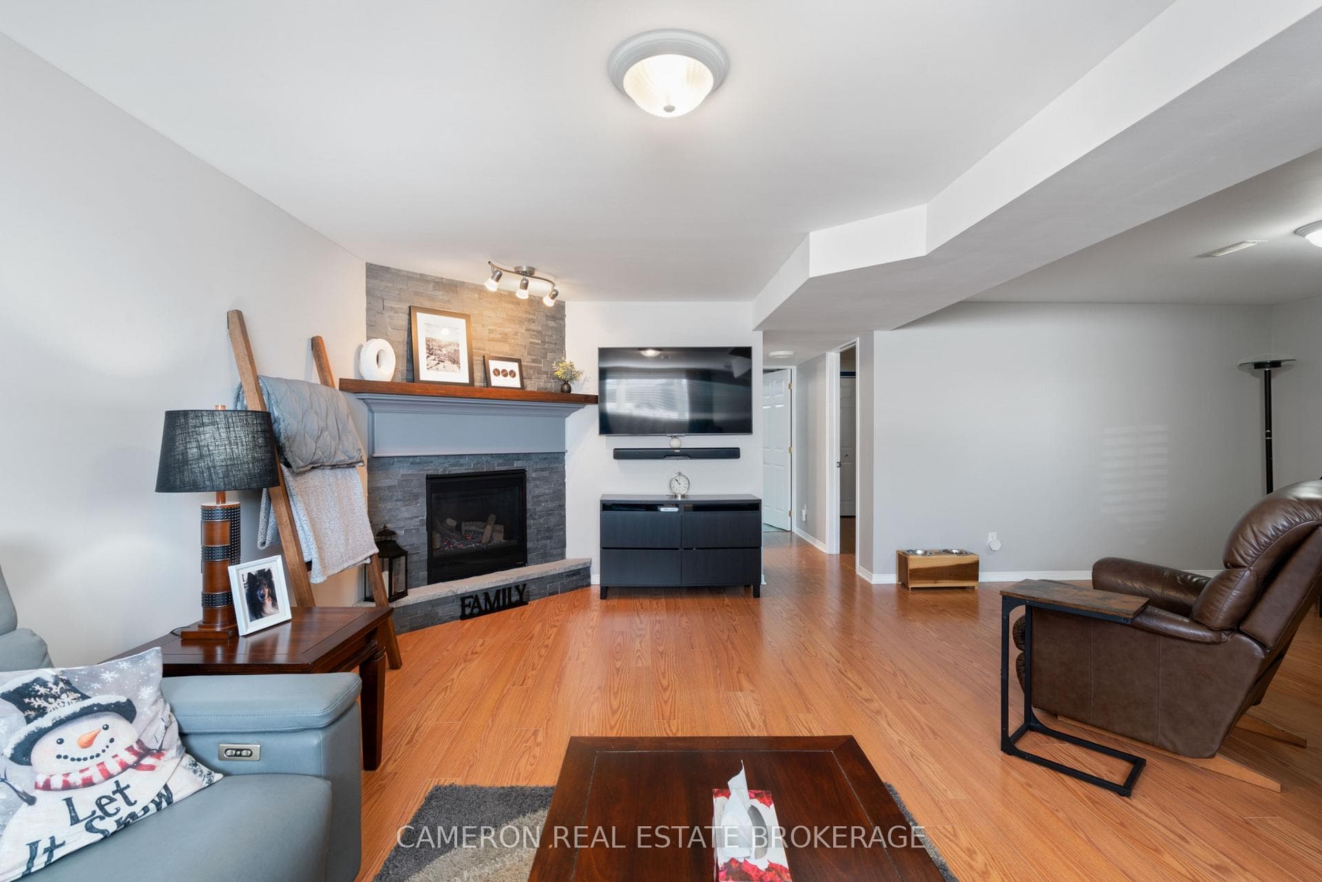 Spacious family room warmed by a gas fireplace
