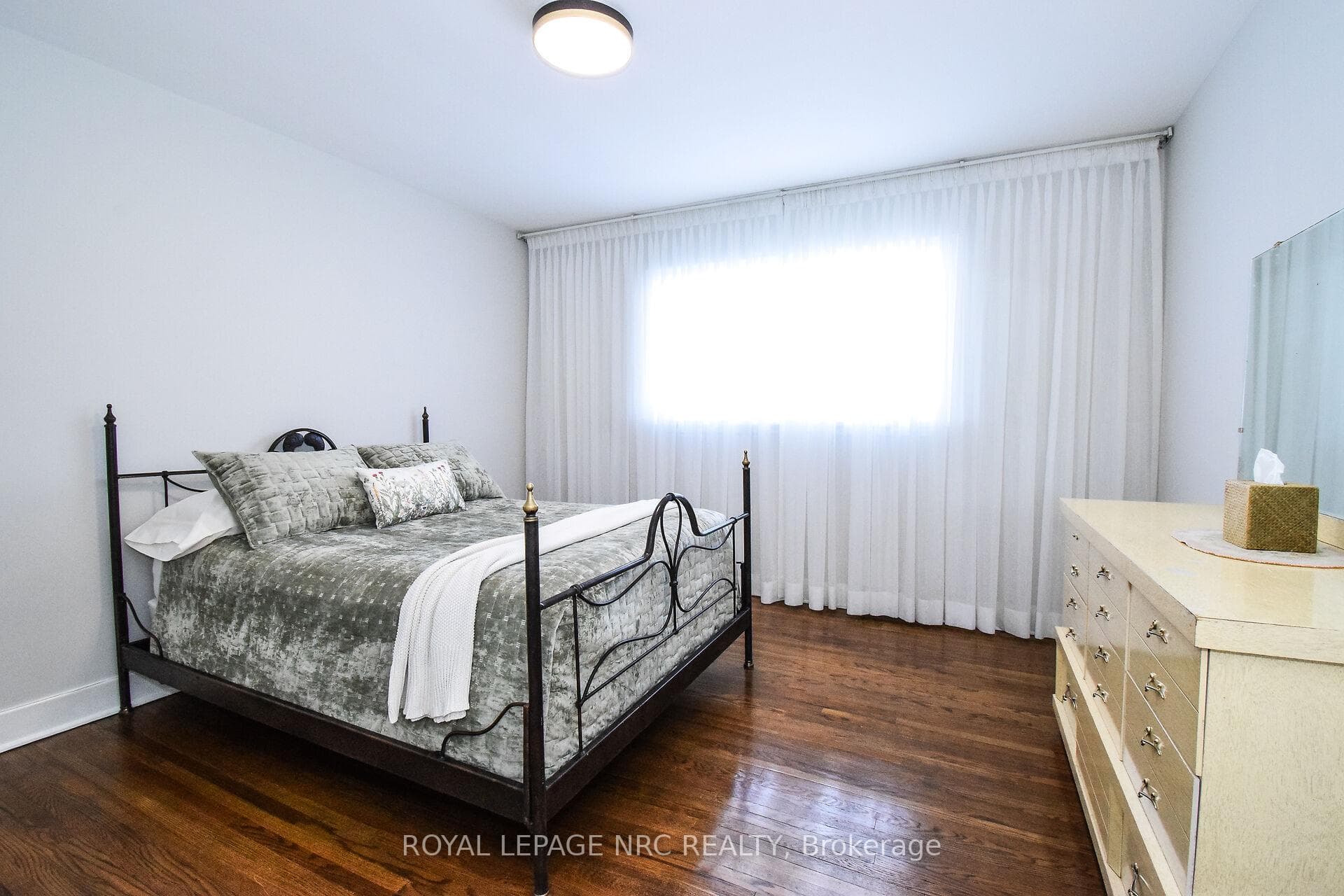 Primary bedroom with original wood floors