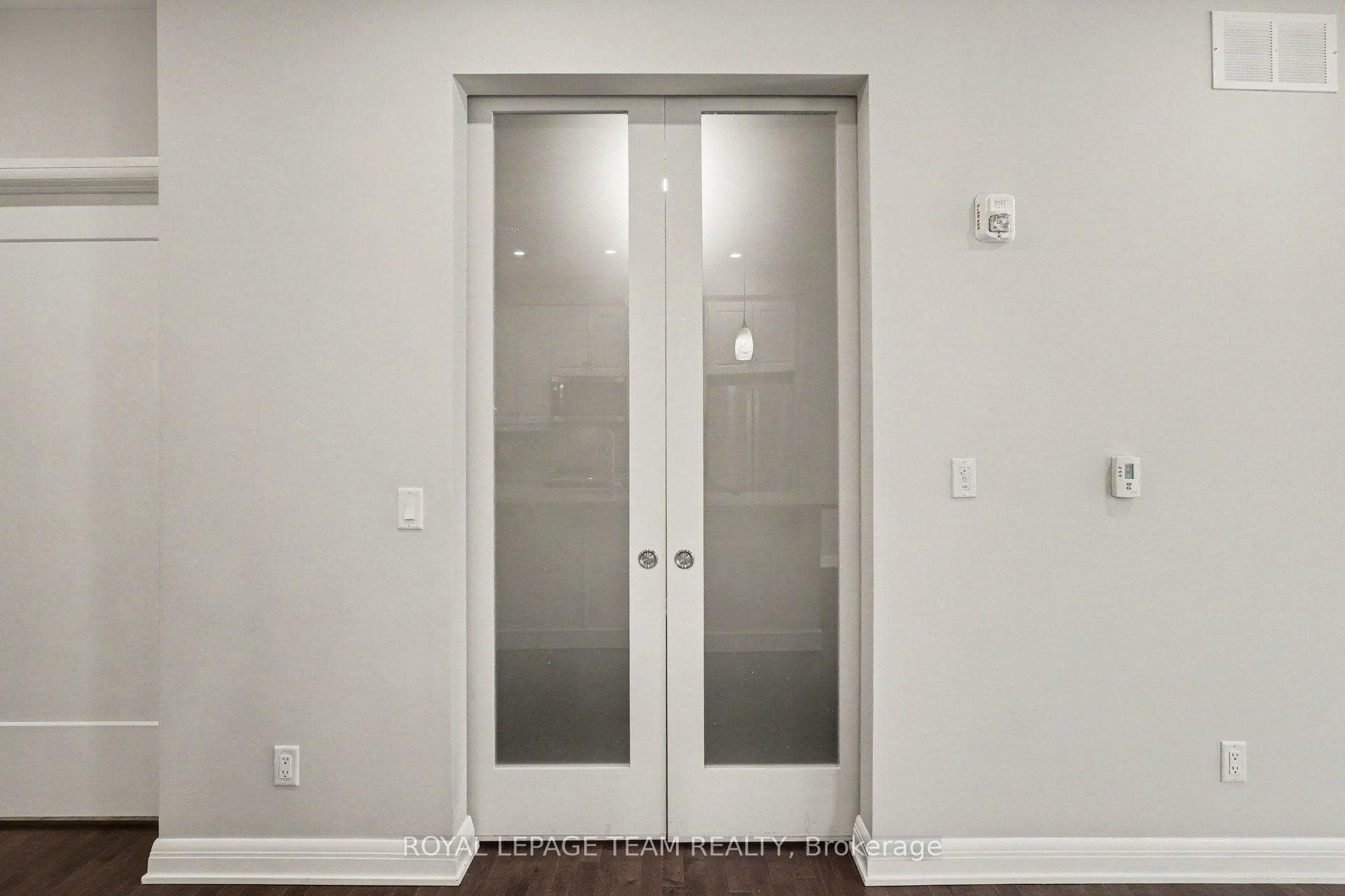 Glass double door to dining room or office