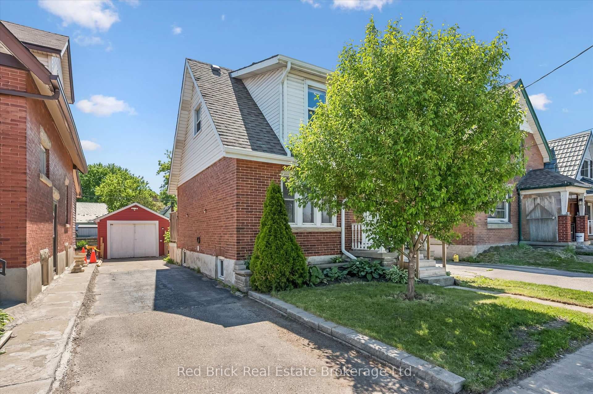 Private driveway to left of home, detached garage