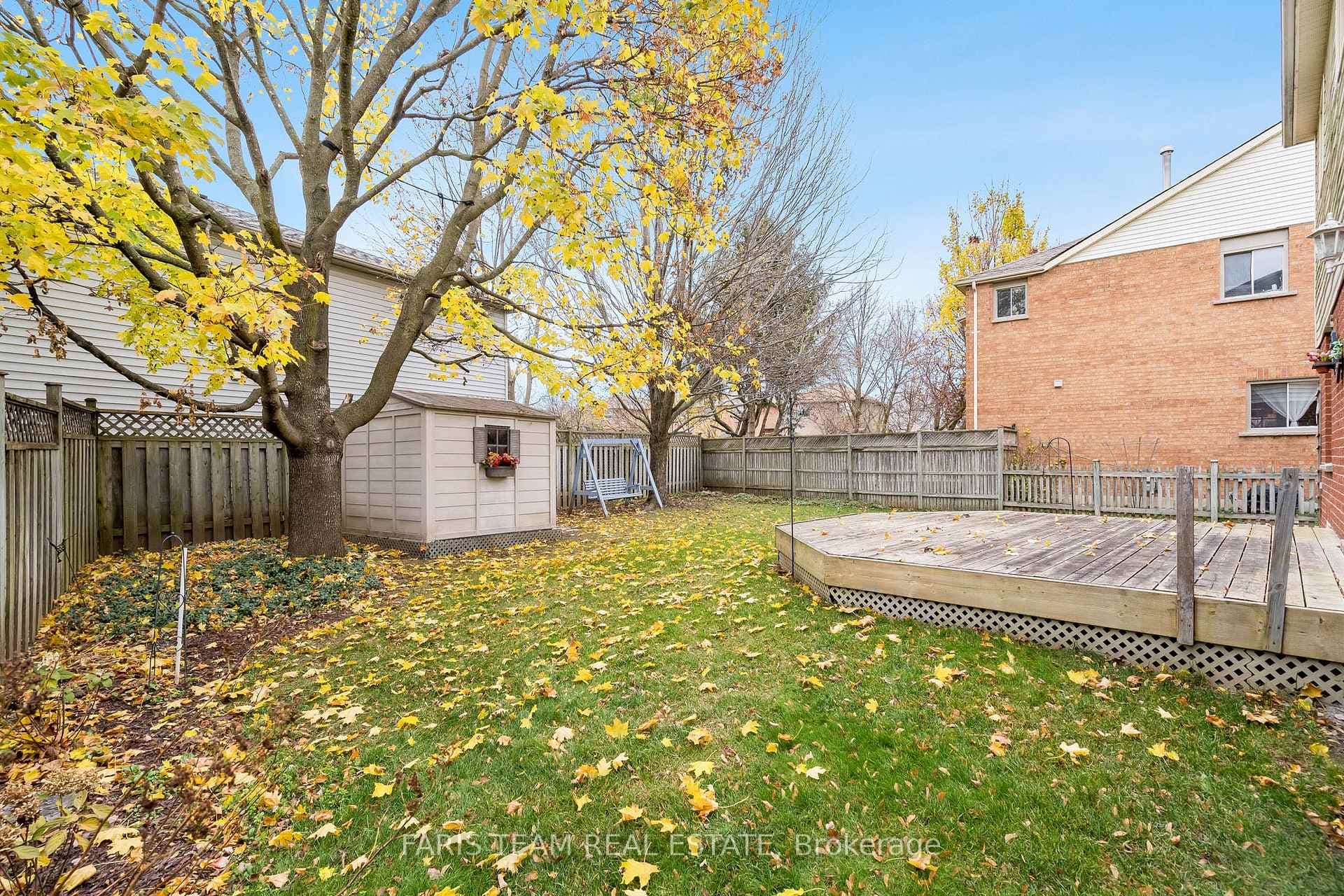 View of yard with a shed and a deck