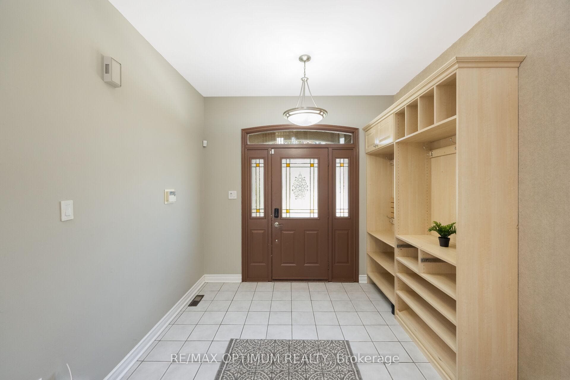 Bright foyer with custom built-in organizers