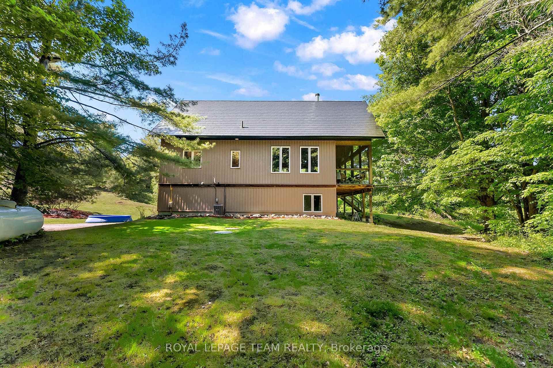 Side view of home with beautiful gardens