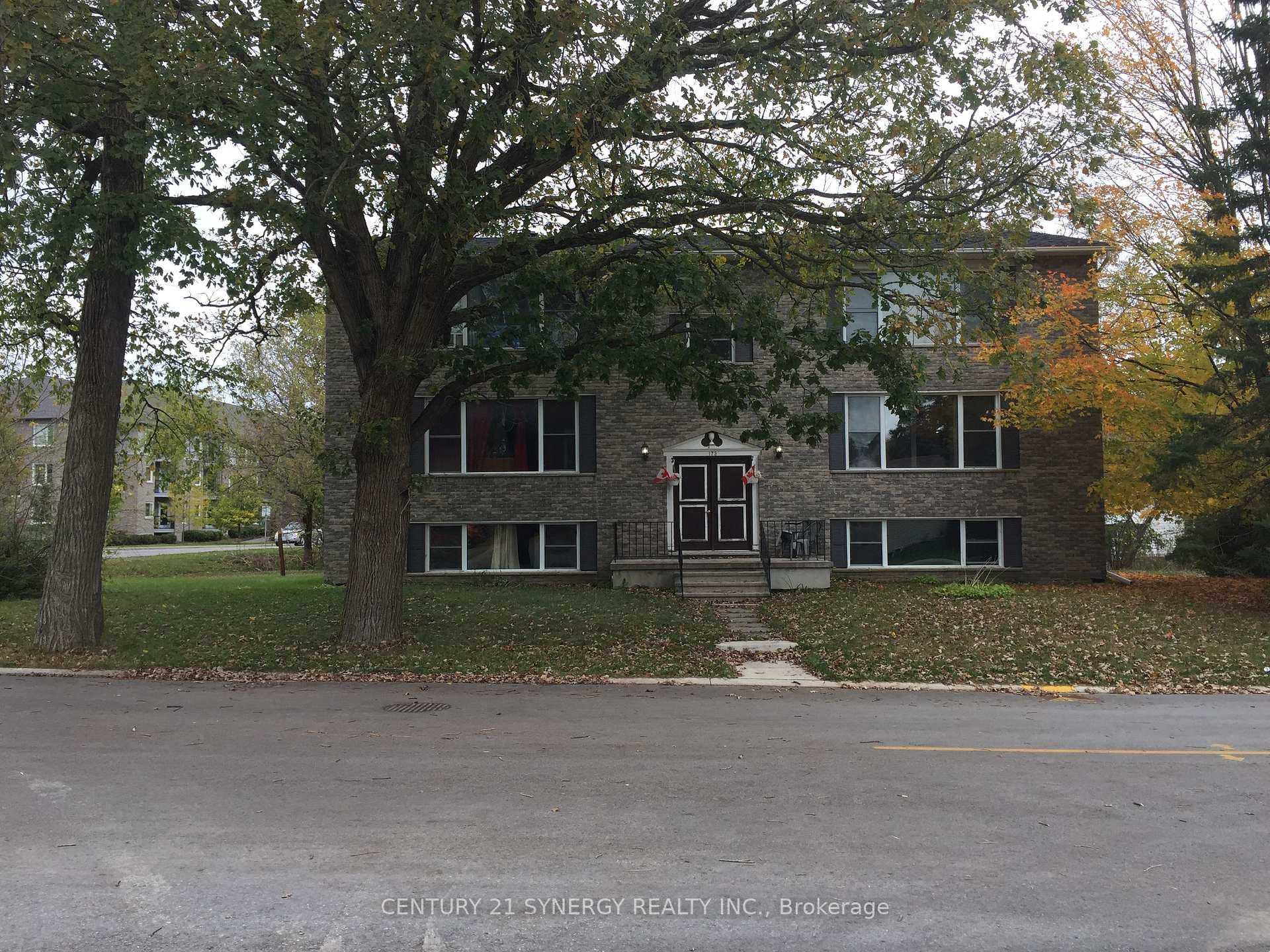 Park like street view of the building