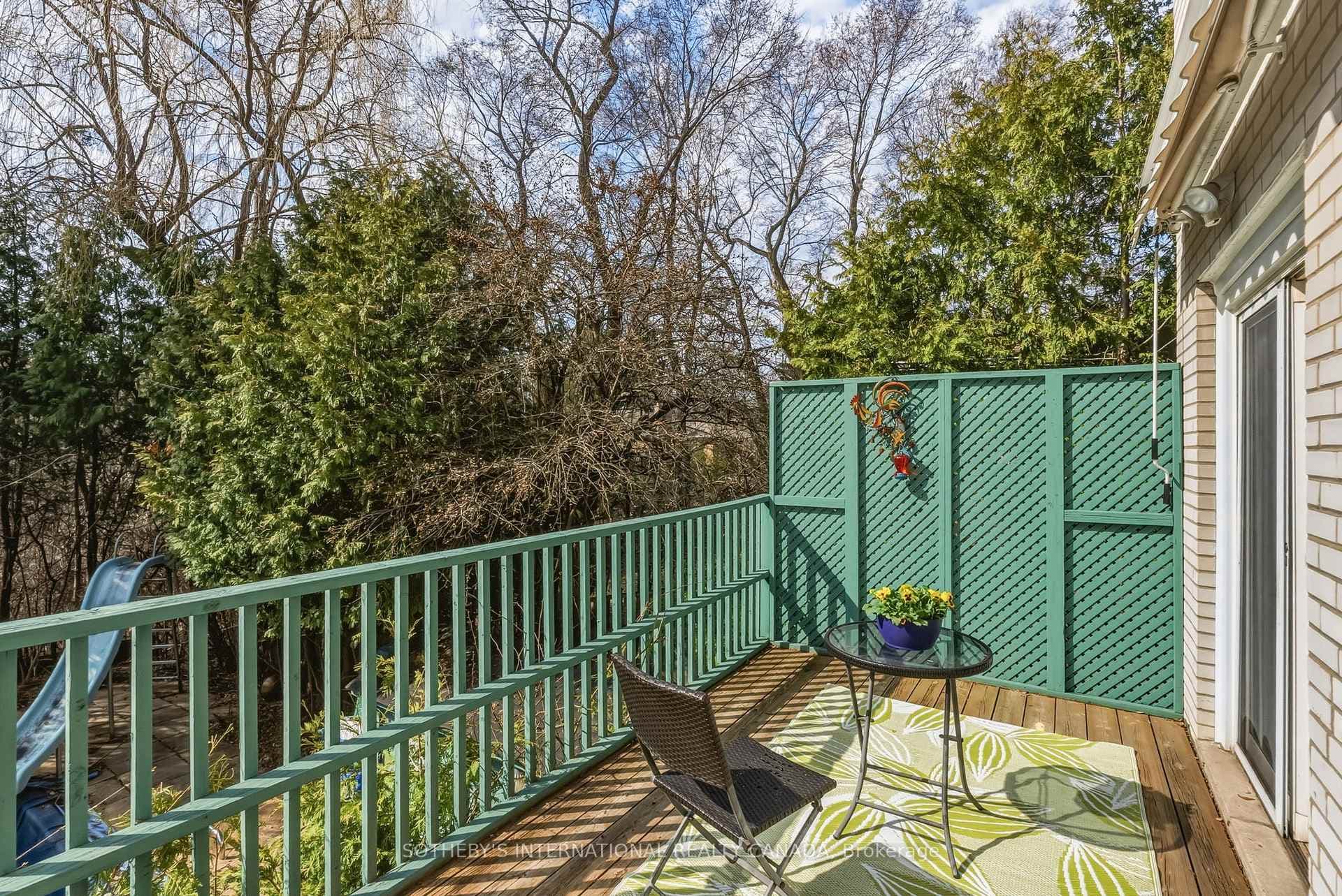 Deck off of the kitchen overlooking backyard