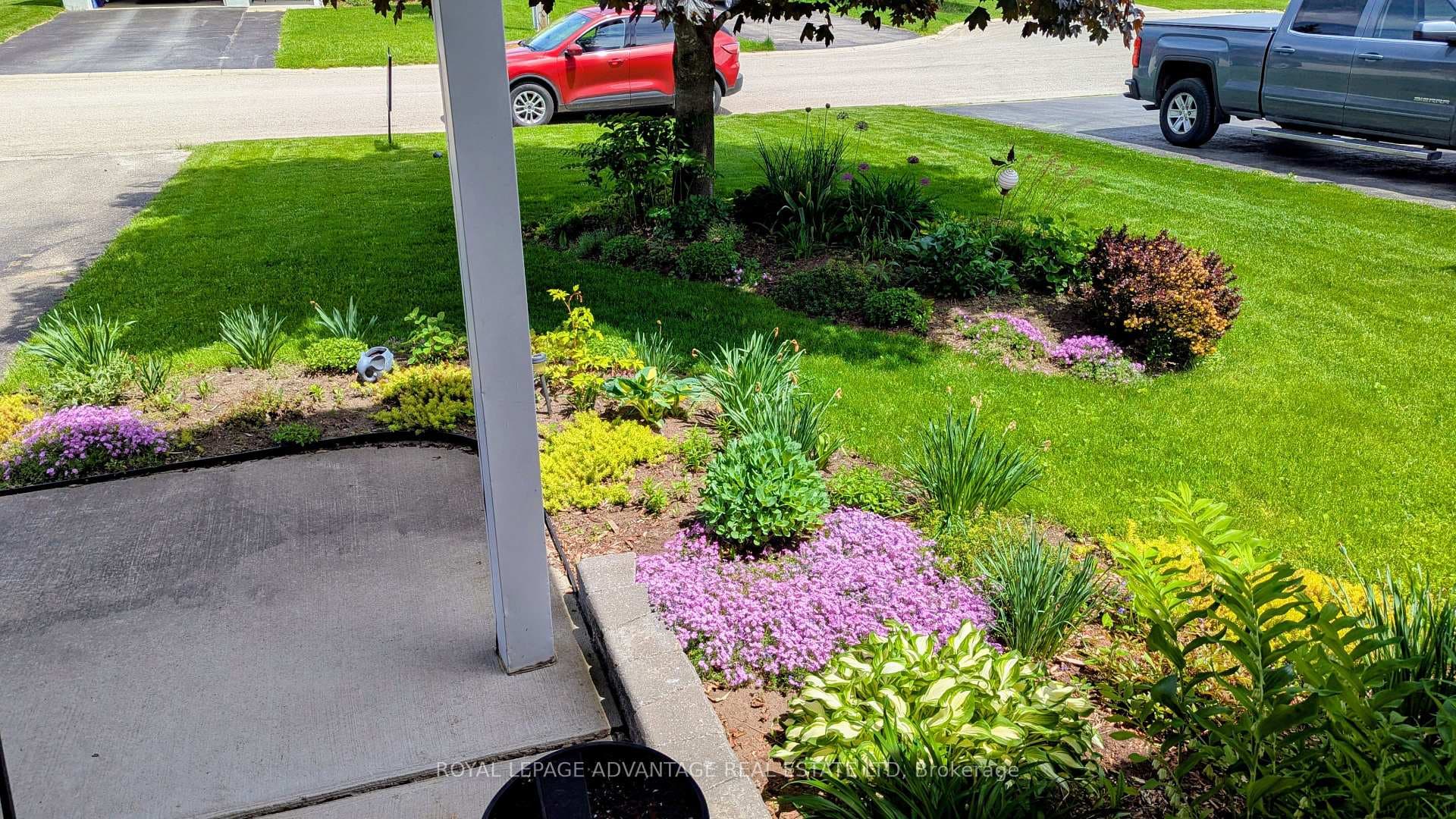 Pretty flowerbed view from entry to home