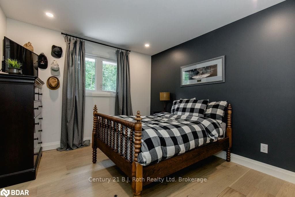 Bedroom featuring light hardwood / wood-style floo