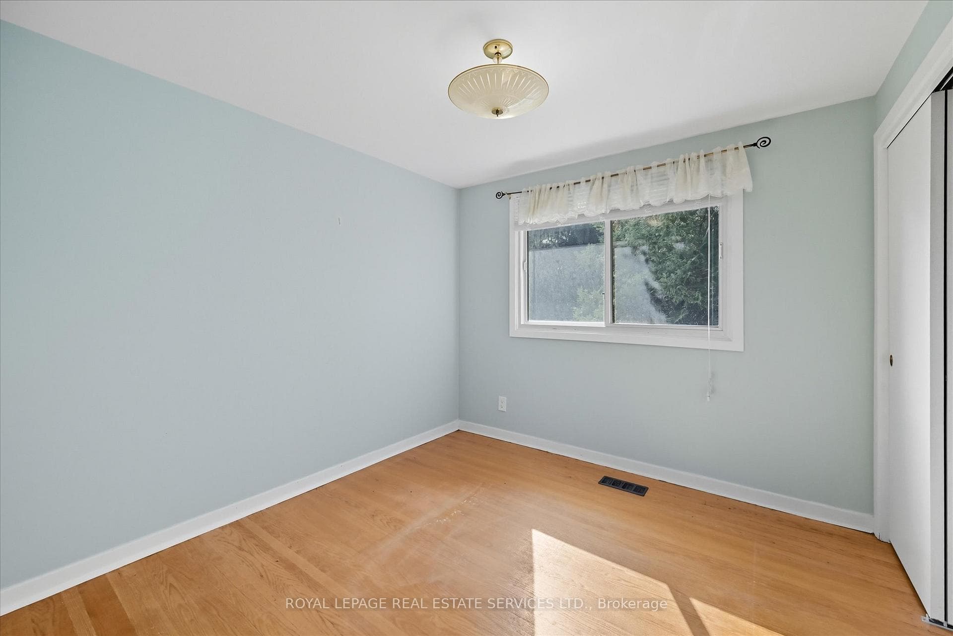 Second Bedroom with Hardwood Flooring