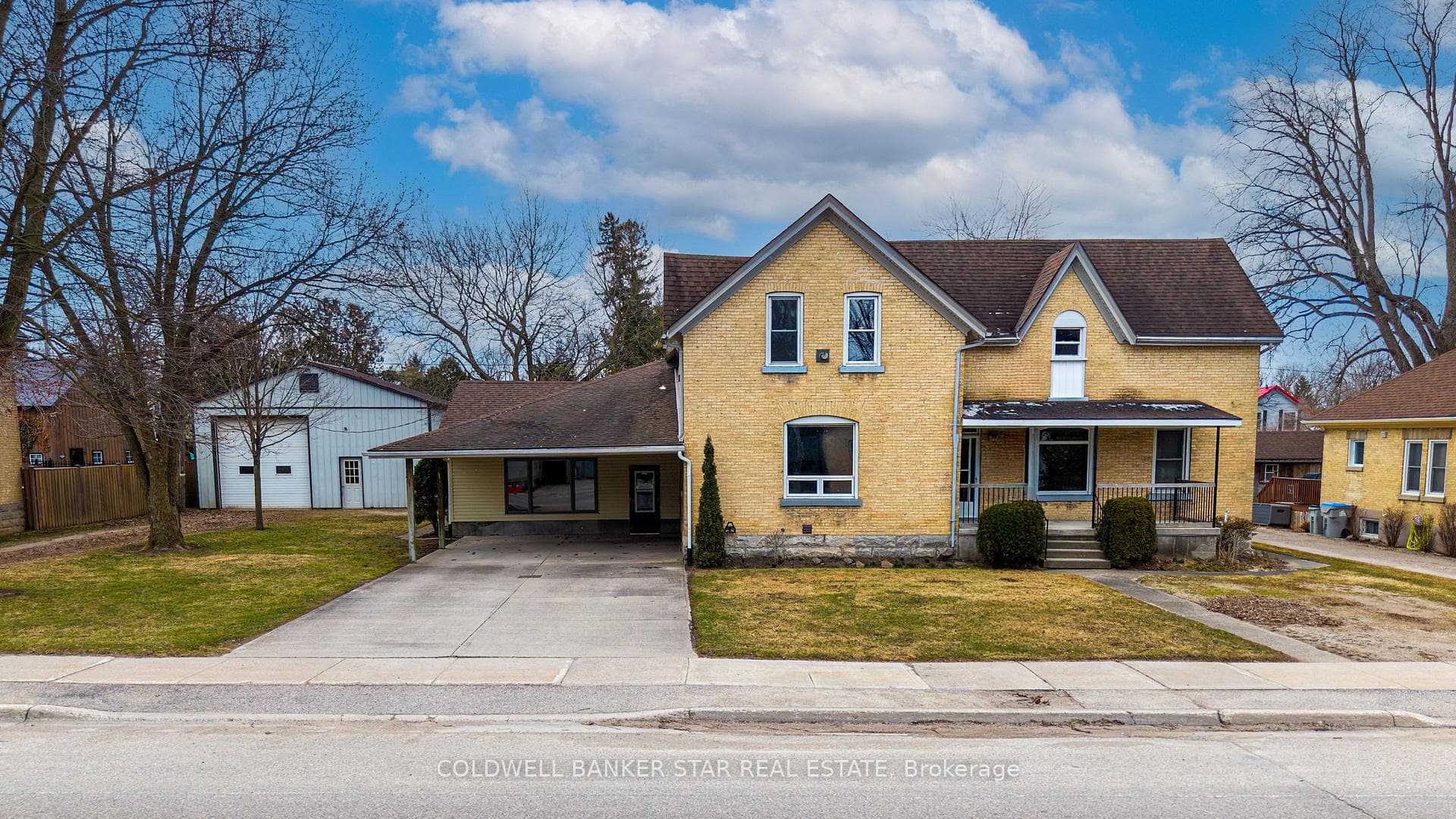 Double cement drive, plus private lane to shop.