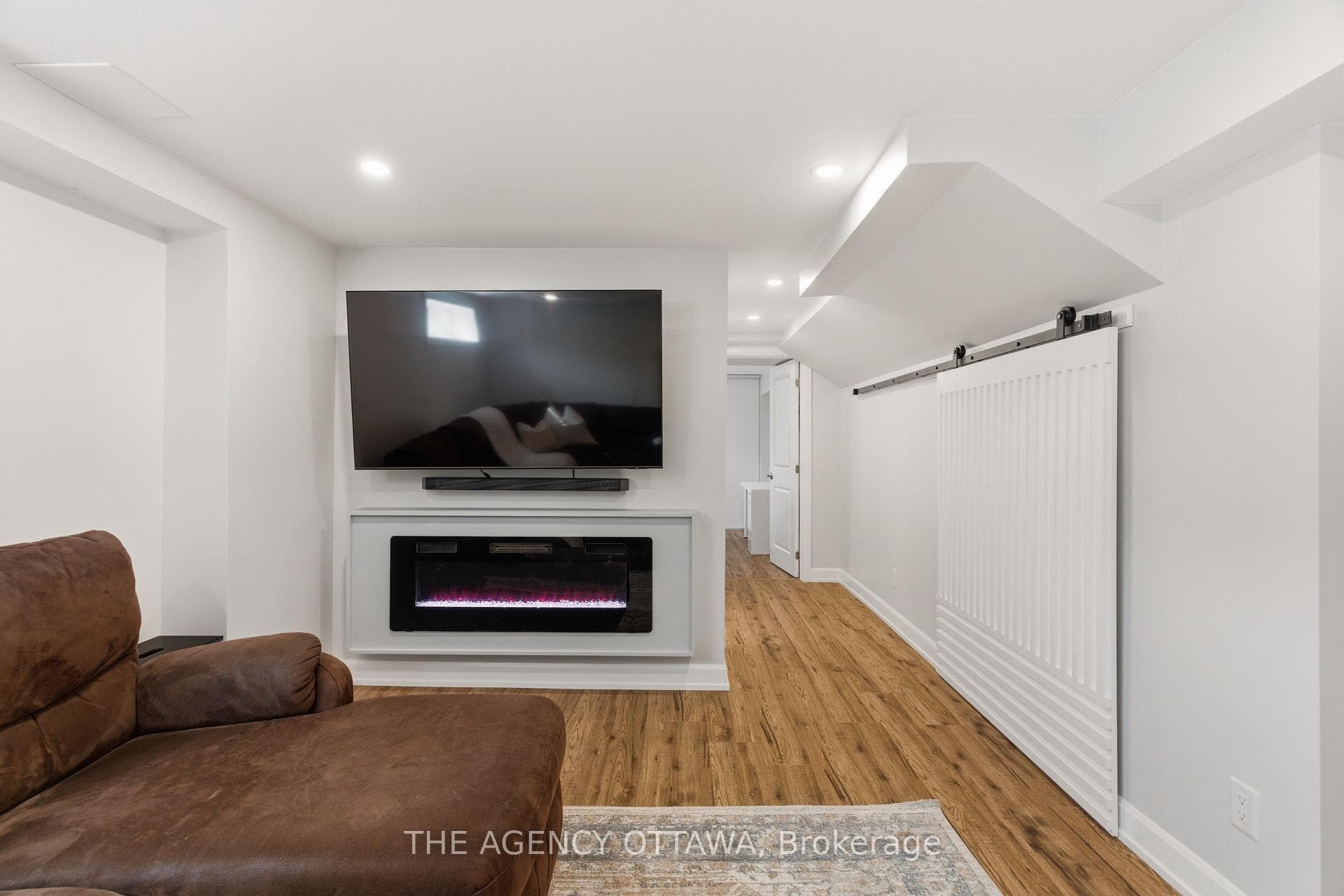 Basement Rec Room Leads to Bathroom + Guest Room