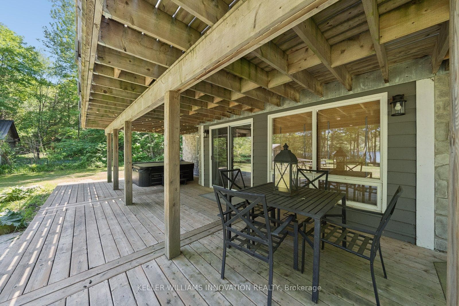 Lower Deck with hottub and exterior dining table