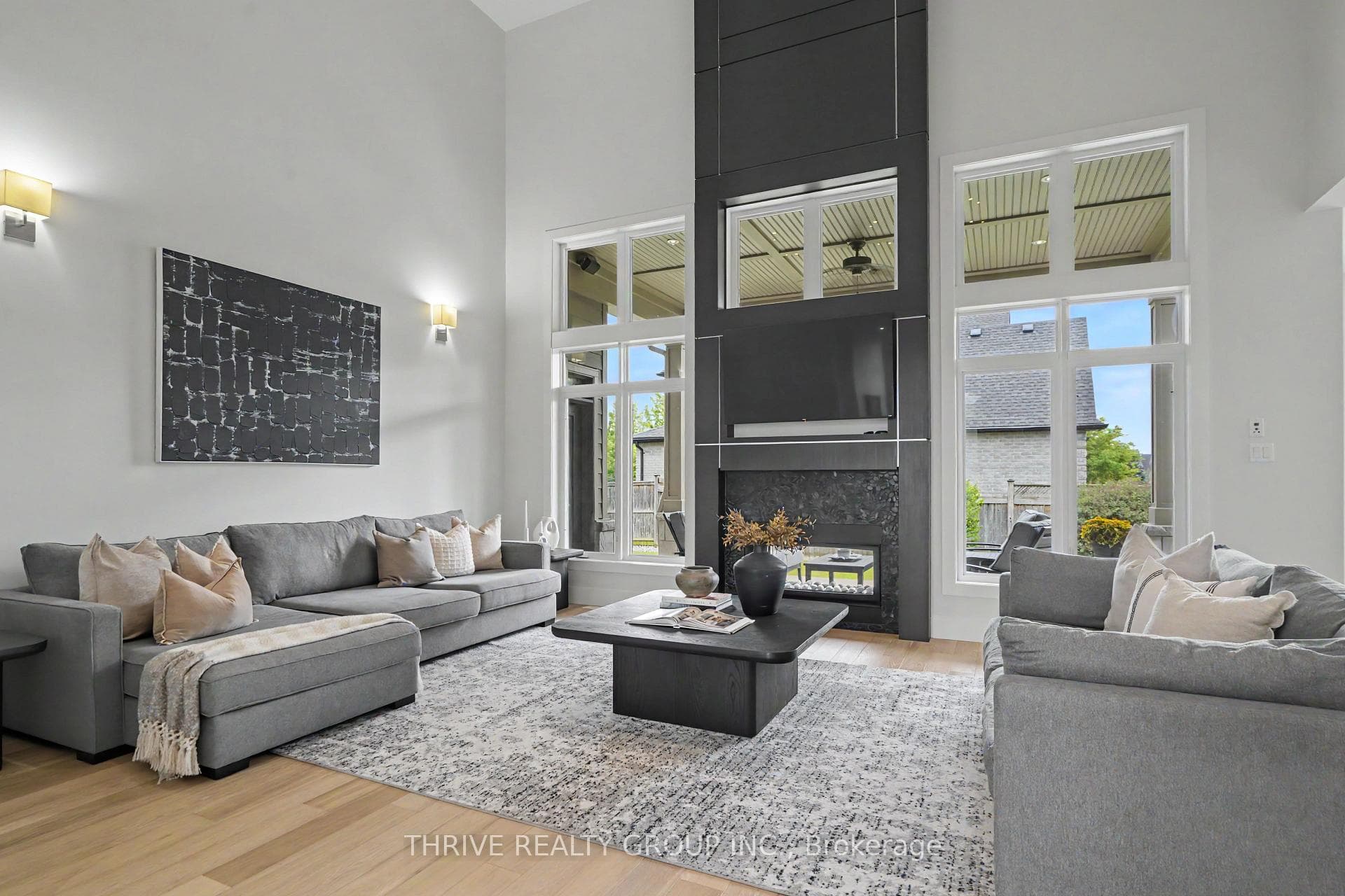 Dramatic Great room with dual sided fireplace