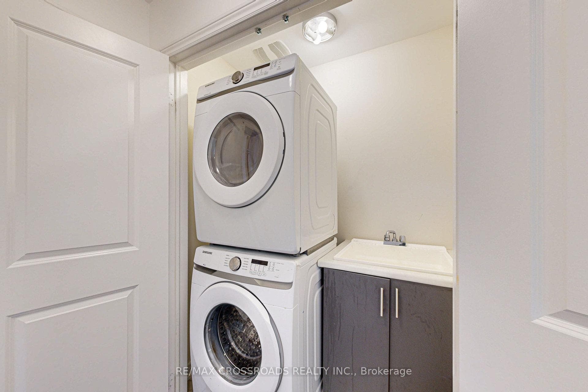 Main floor stacked full size washer and dryer