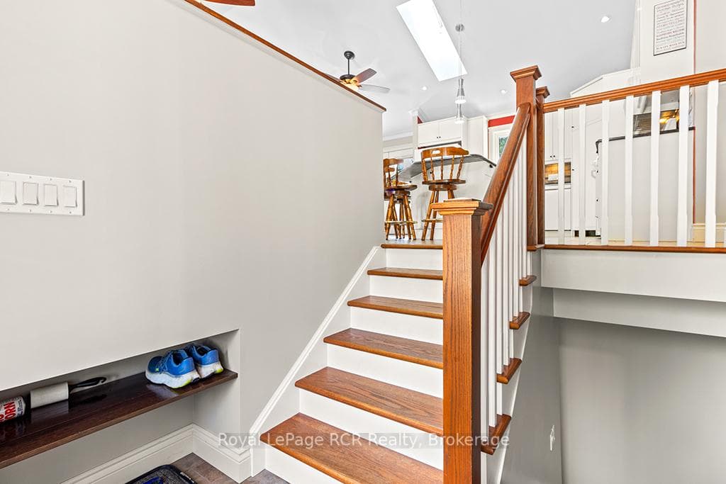 Enter foyer with cubby storage & solid wood stairs