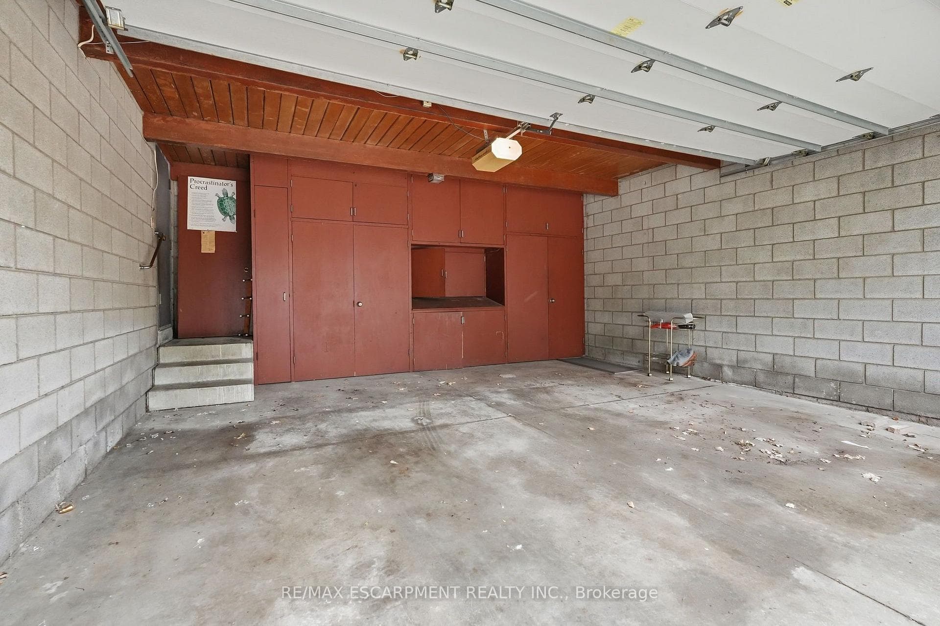 Spacious garage featuring concrete block walls