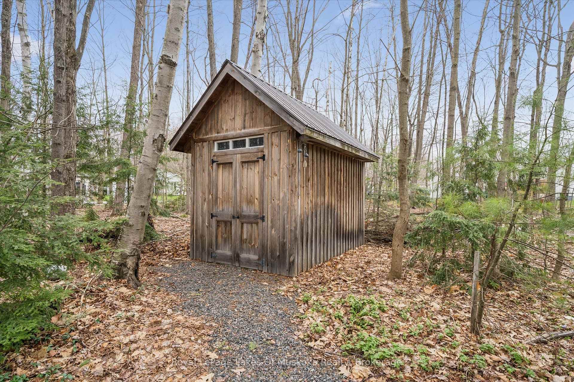 Shed on concrete pad with metal rook
